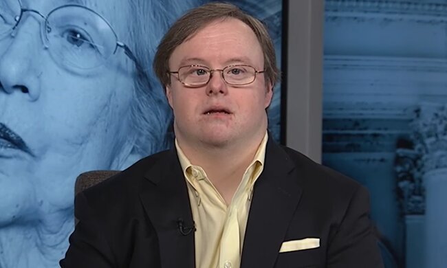 Mann mit dem Down-Syndrom. Quelle: YouTube Screenshot